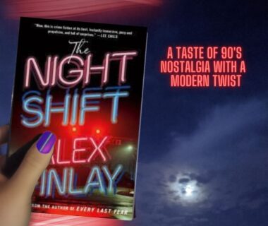 A person holding the book 'The Night Shift' by Alex Finlay up to the night sky